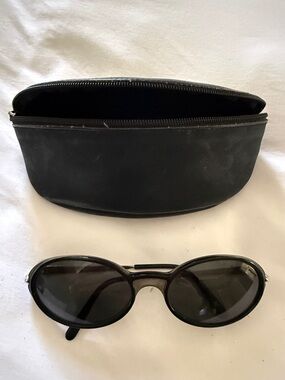Cartier Black Oval Sunglasses with Black Zip Case